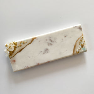 marble cheese board with golden feet