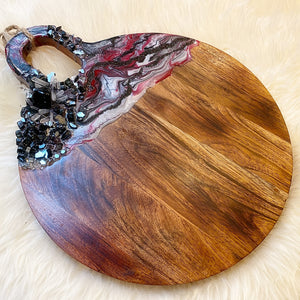 black and red round charcuterie board